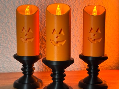 Spooky Jack-O'-Lantern LED Pillar Candles with Candlesticks (Set of 3)