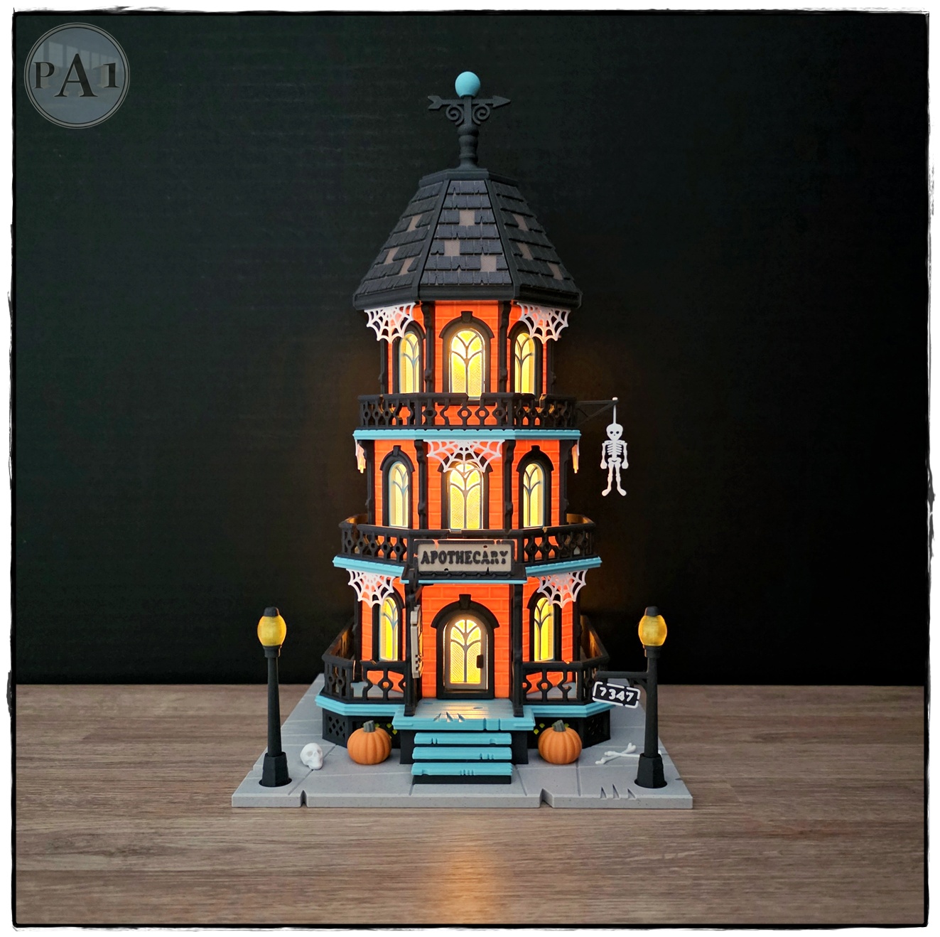 The Apothecary 3D printed three-story Victorian Halloween shop with street lamps, pumpkins and hanging skeleton