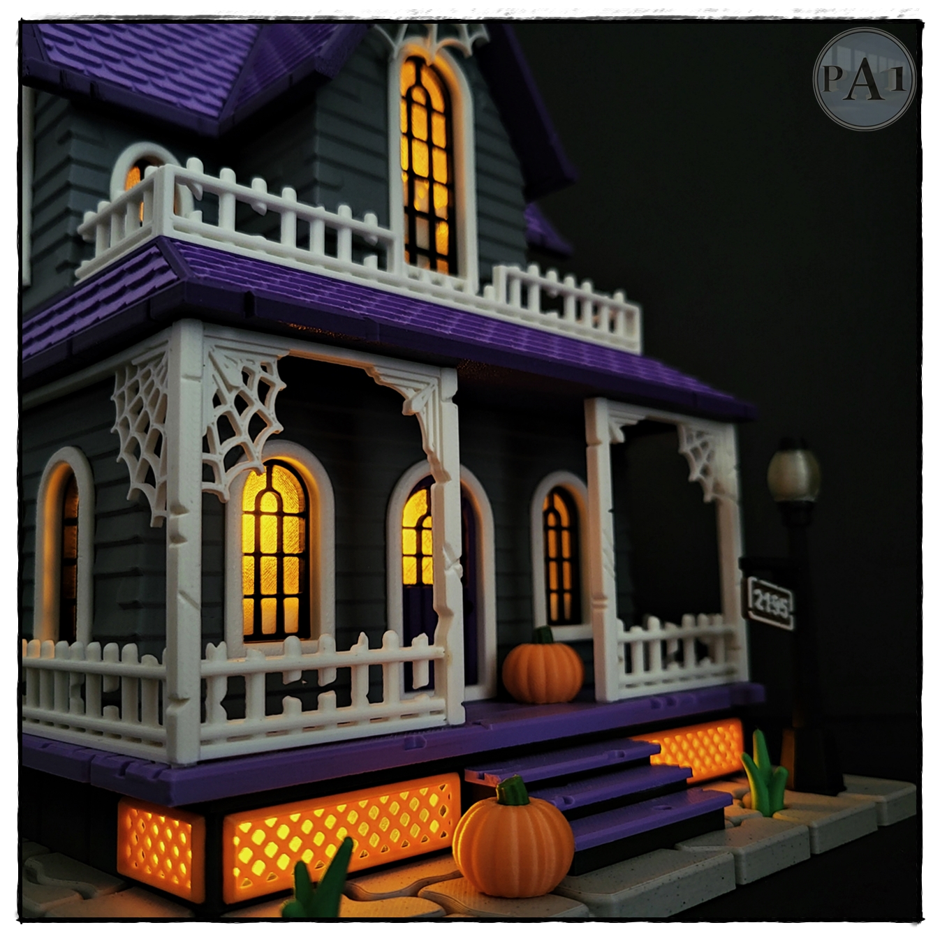 The Haunted House 3D printed Victorian Halloween house with purple roof, porch and glowing windows