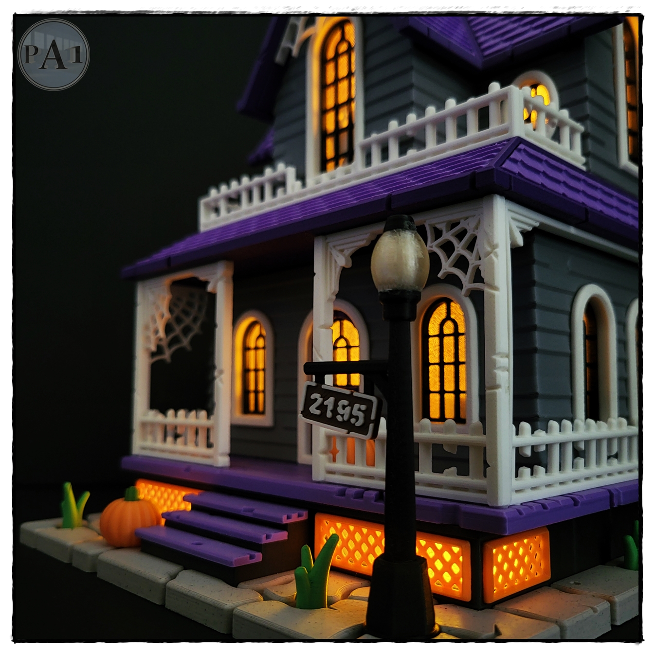 The Haunted House 3D printed Victorian Halloween house with purple roof, porch and glowing windows