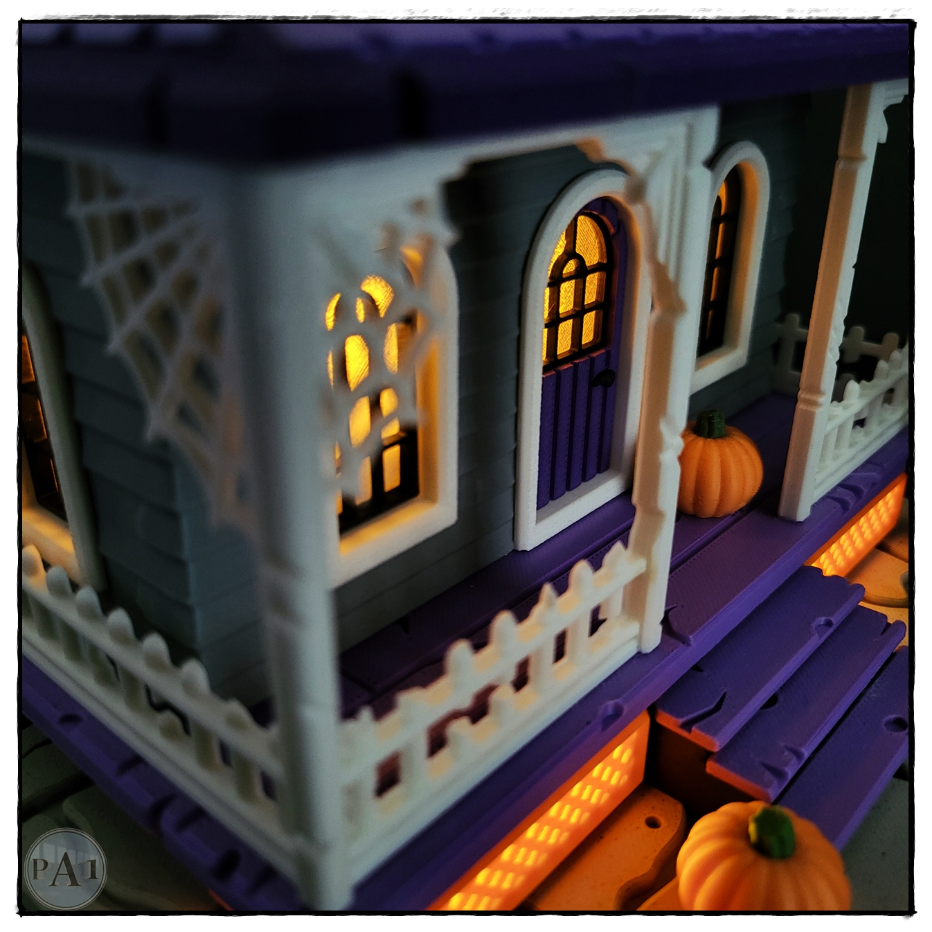 The Haunted House 3D printed Victorian Halloween house with purple roof, porch and glowing windows