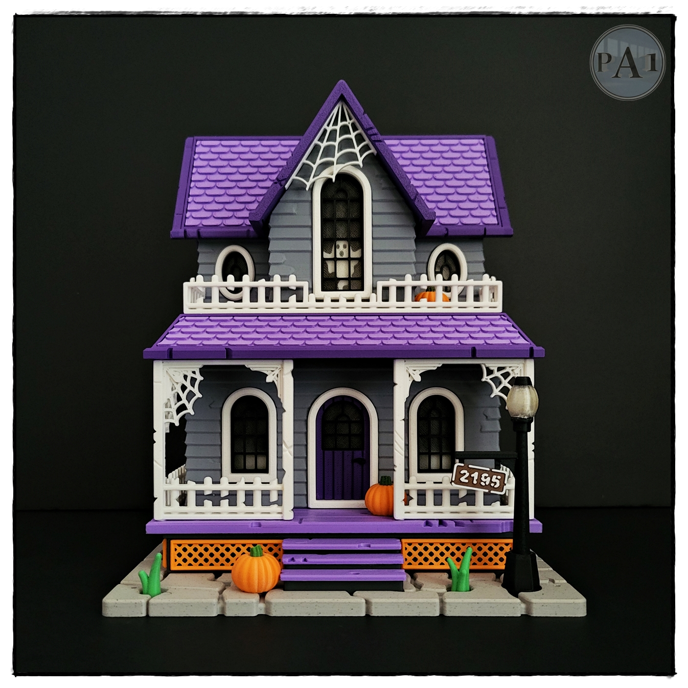 The Haunted House 3D printed Victorian Halloween house with purple roof, porch and glowing windows