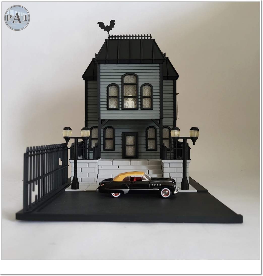 The Haunted Manor 3D printed Victorian haunted mansion on a hillside base with glowing windows