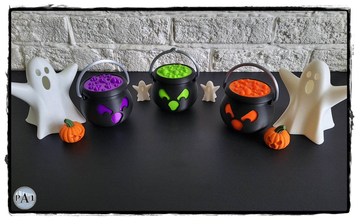 Three Tealight Spooky Cauldrons in purple, green and orange with ghosts and pumpkins