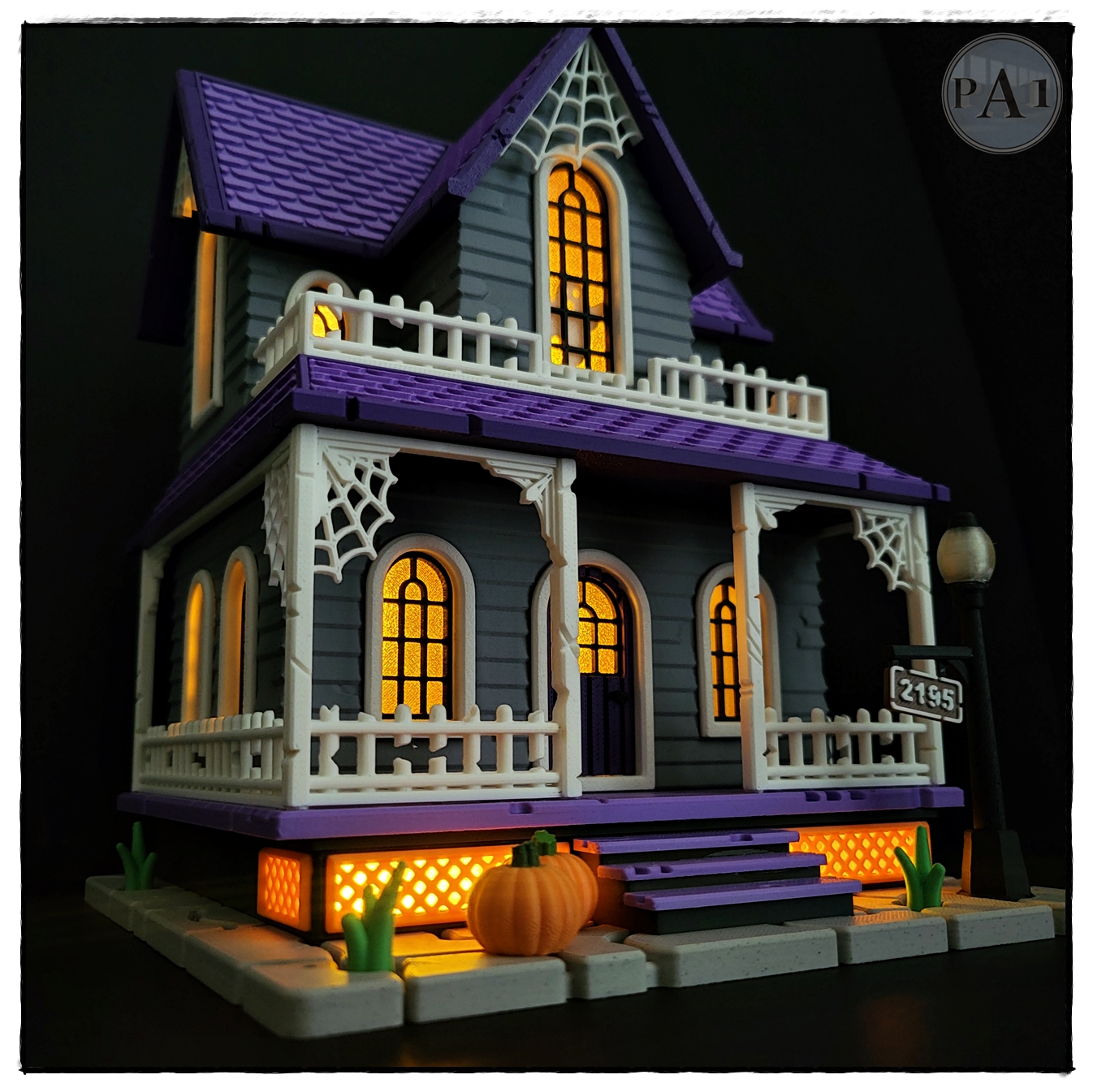 The Haunted House 3D printed Victorian Halloween house with purple roof, porch and glowing windows
