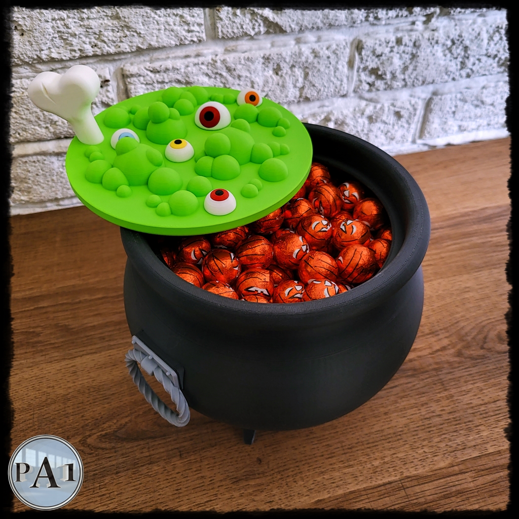 Witch's Brew Candy Bowl Cauldron 3D printed black cauldron with green bubbling brew lid, eyeballs and bone handle