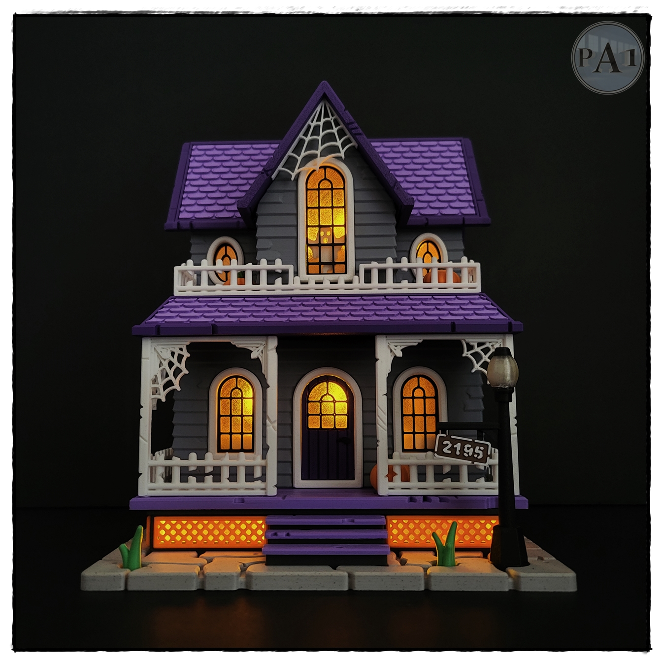 The Haunted House 3D printed Victorian Halloween house with purple roof, porch and glowing windows