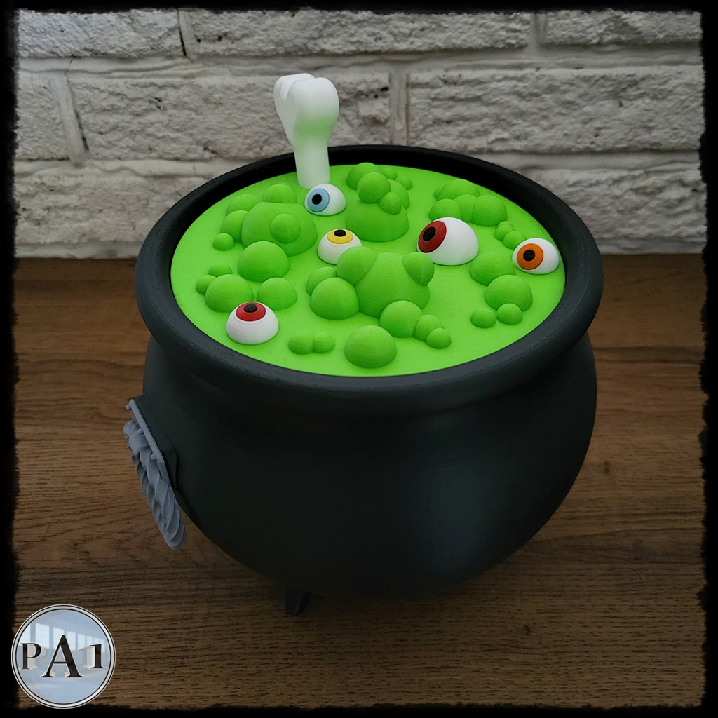 Witch's Brew Candy Bowl Cauldron 3D printed black cauldron with green bubbling brew lid, eyeballs and bone handle