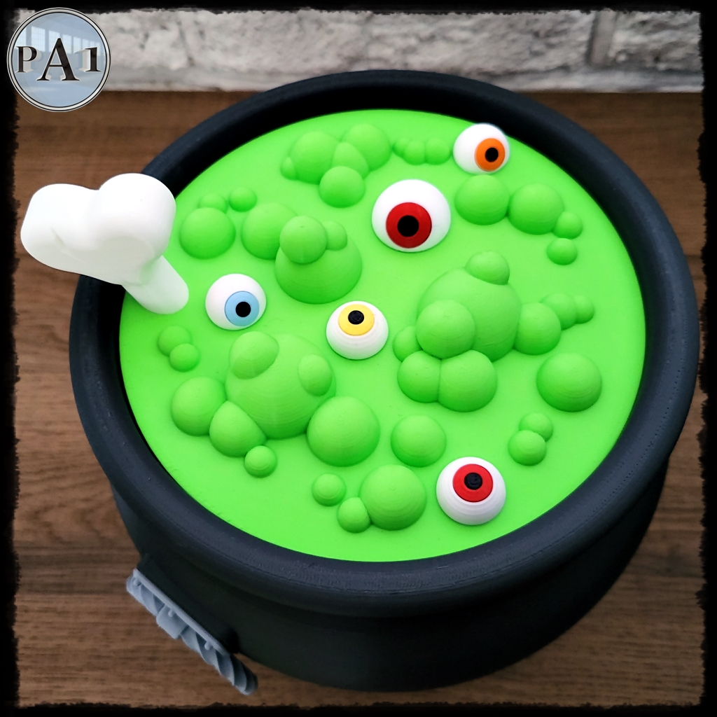 Witch's Brew Candy Bowl Cauldron 3D printed black cauldron with green bubbling brew lid, eyeballs and bone handle