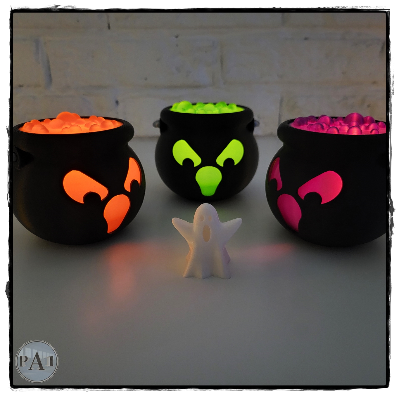 Glowing Tealight Spooky Cauldrons with a small ghost figure