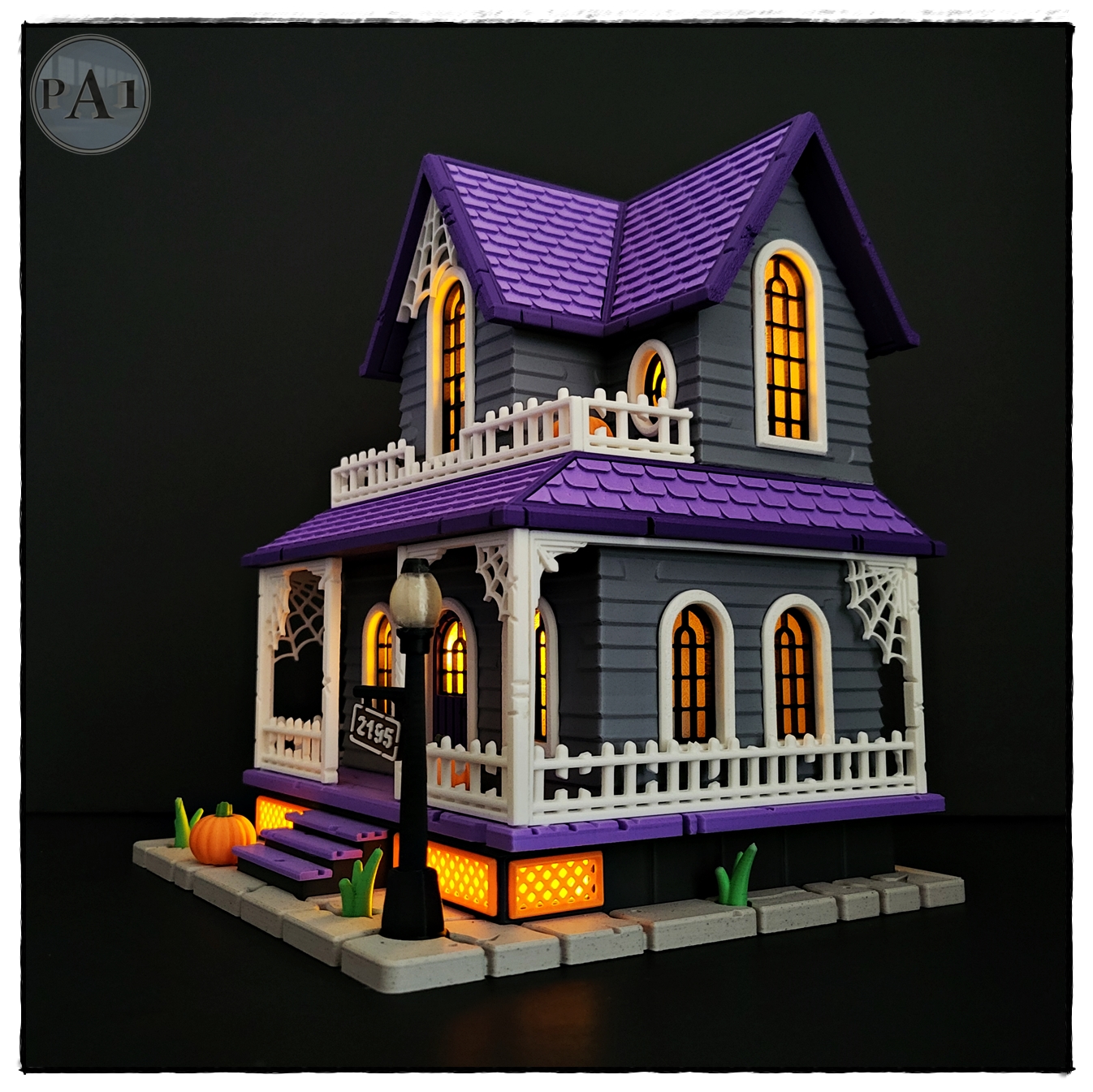 The Haunted House 3D printed Victorian Halloween house with purple roof, porch and glowing windows