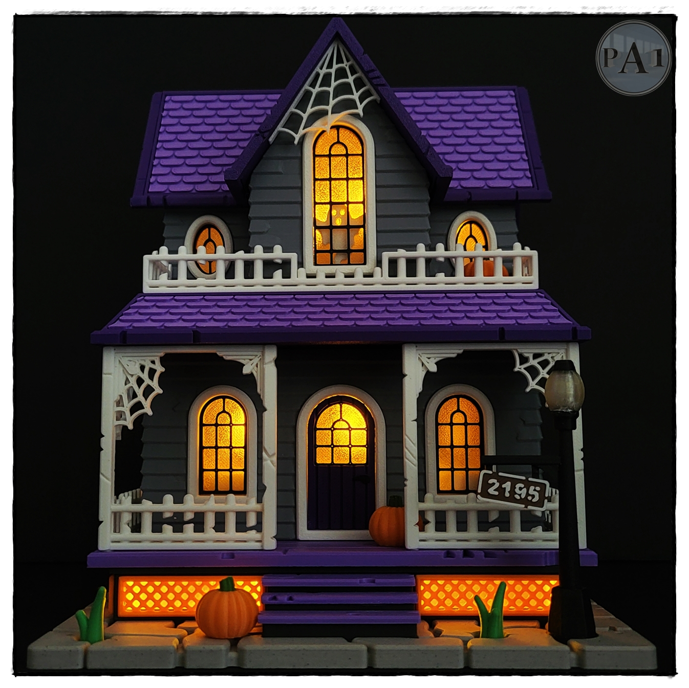 The Haunted House 3D printed Victorian Halloween house with purple roof, porch and glowing windows