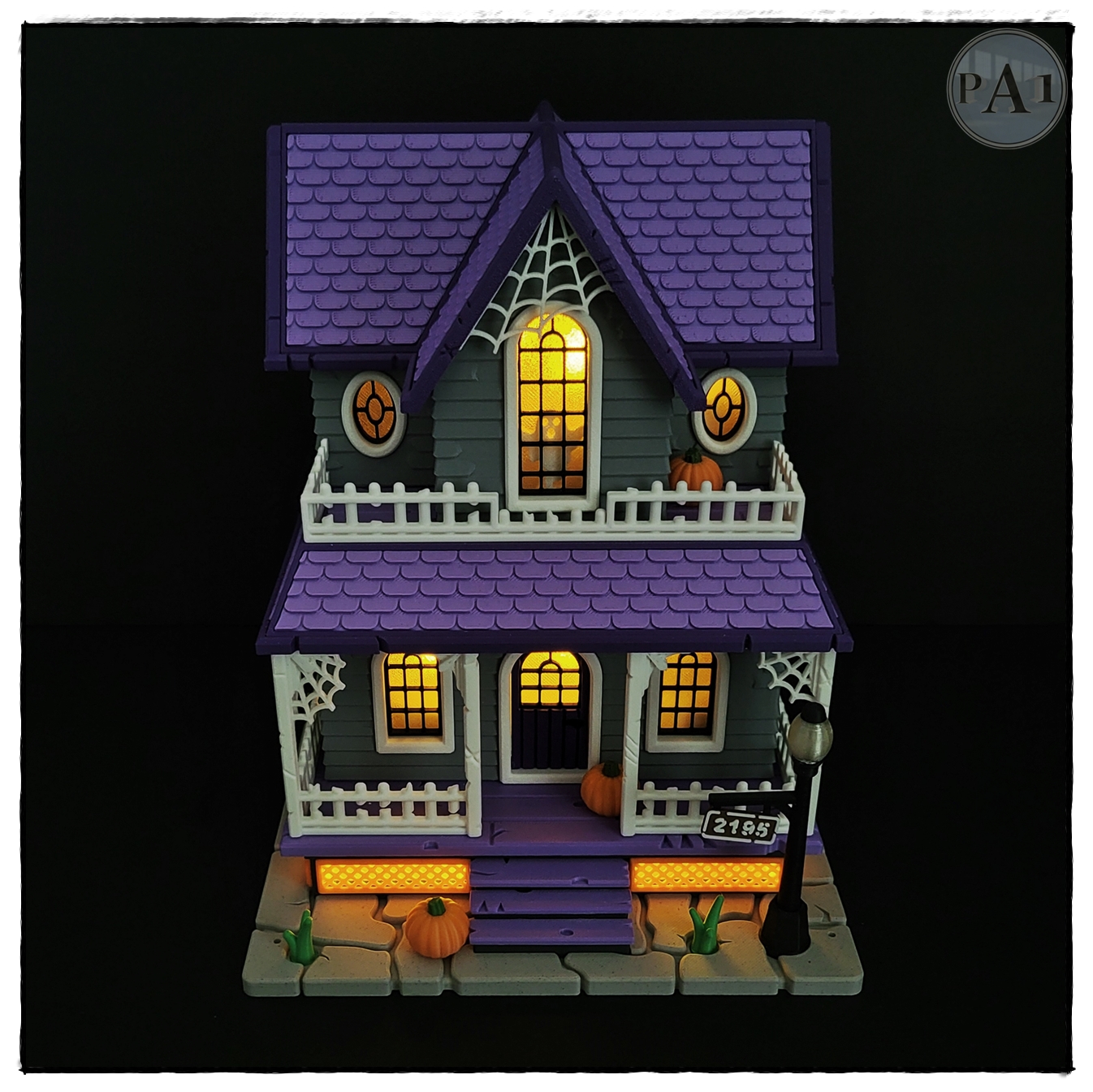 The Haunted House 3D printed Victorian Halloween house with purple roof, porch and glowing windows