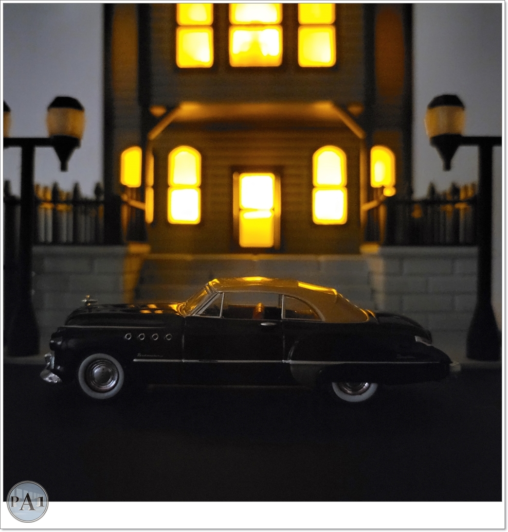 The Haunted Manor 3D printed Victorian haunted mansion on a hillside base with glowing windows