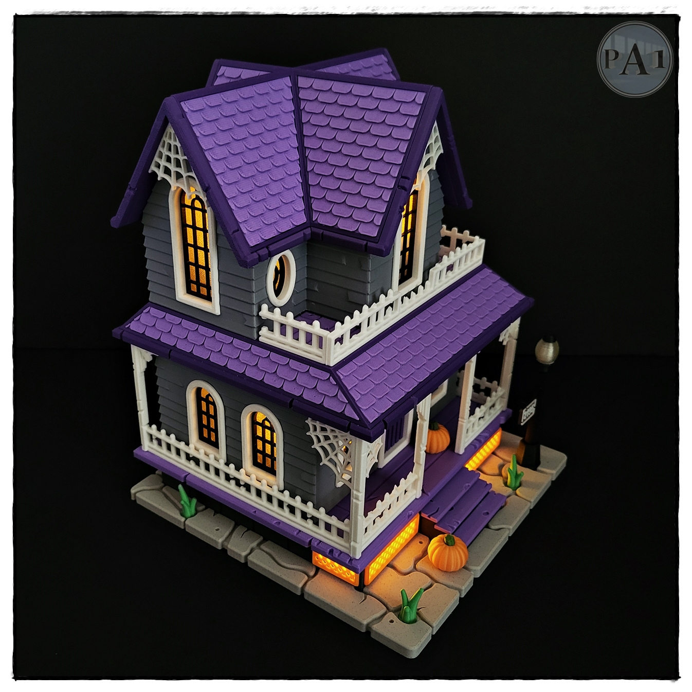 The Haunted House 3D printed Victorian Halloween house with purple roof, porch and glowing windows