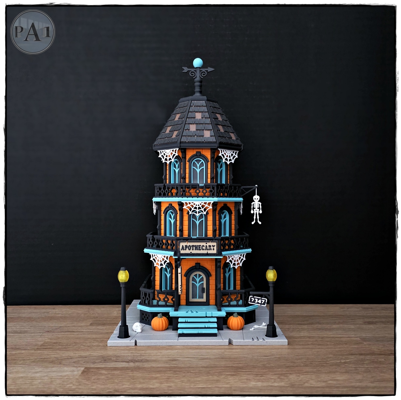 The Apothecary 3D printed three-story Victorian Halloween shop with street lamps, pumpkins and hanging skeleton