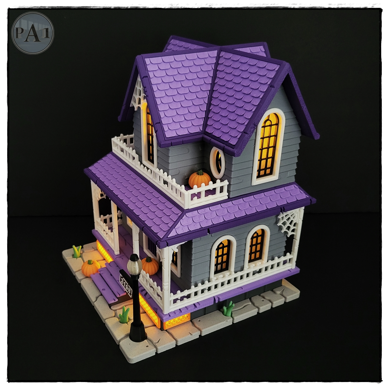 The Haunted House 3D printed Victorian Halloween house with purple roof, porch and glowing windows